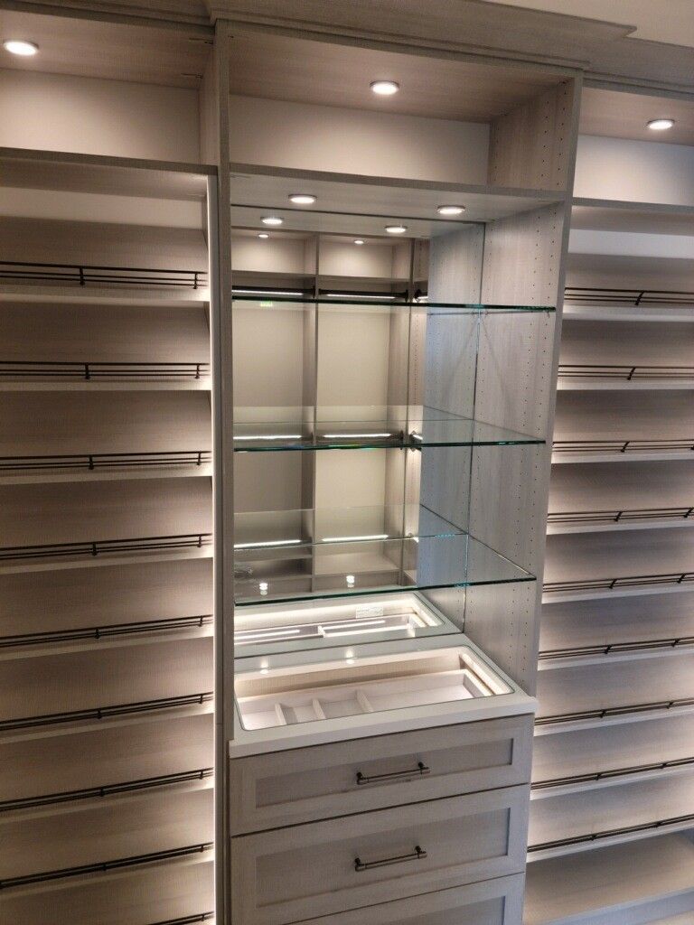 Custom walk-in closets can include beautiful lighting options.