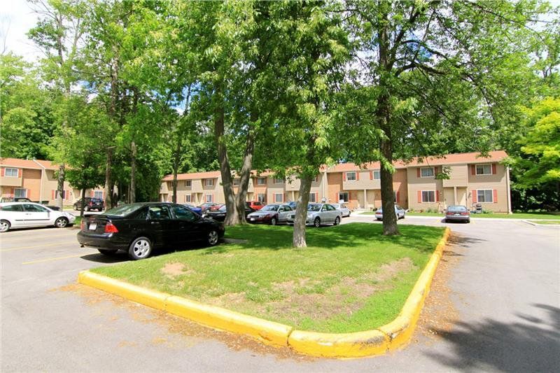 A view of the parking lot at Rustic Woods Townhomes