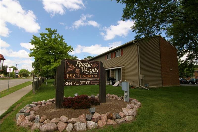 The sign outside of Rustic Woods Town