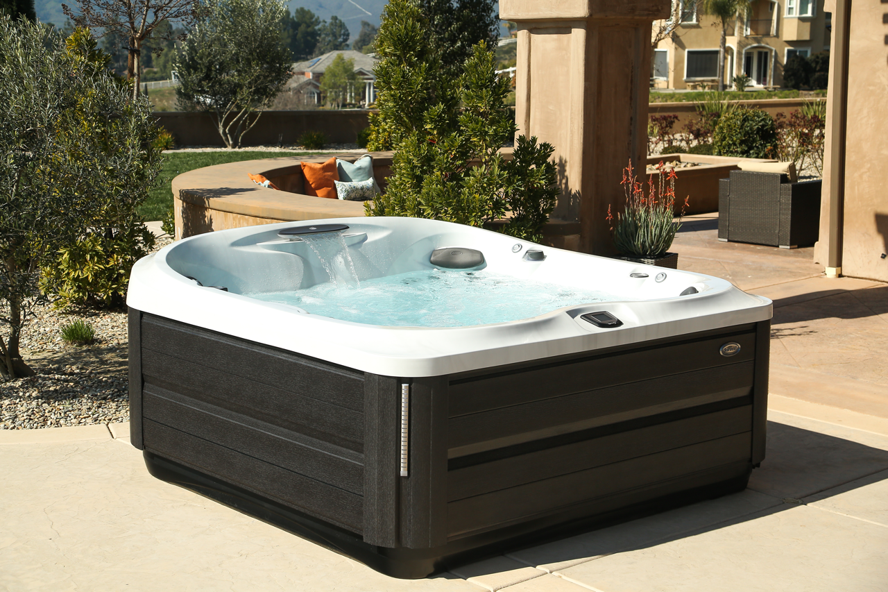 A white and brown hot tub with a wooden base on a white background.