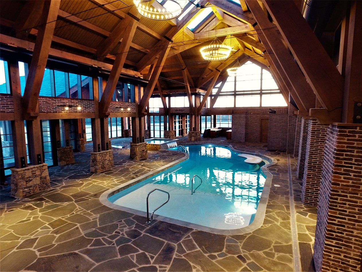 A large indoor swimming pool in a large building