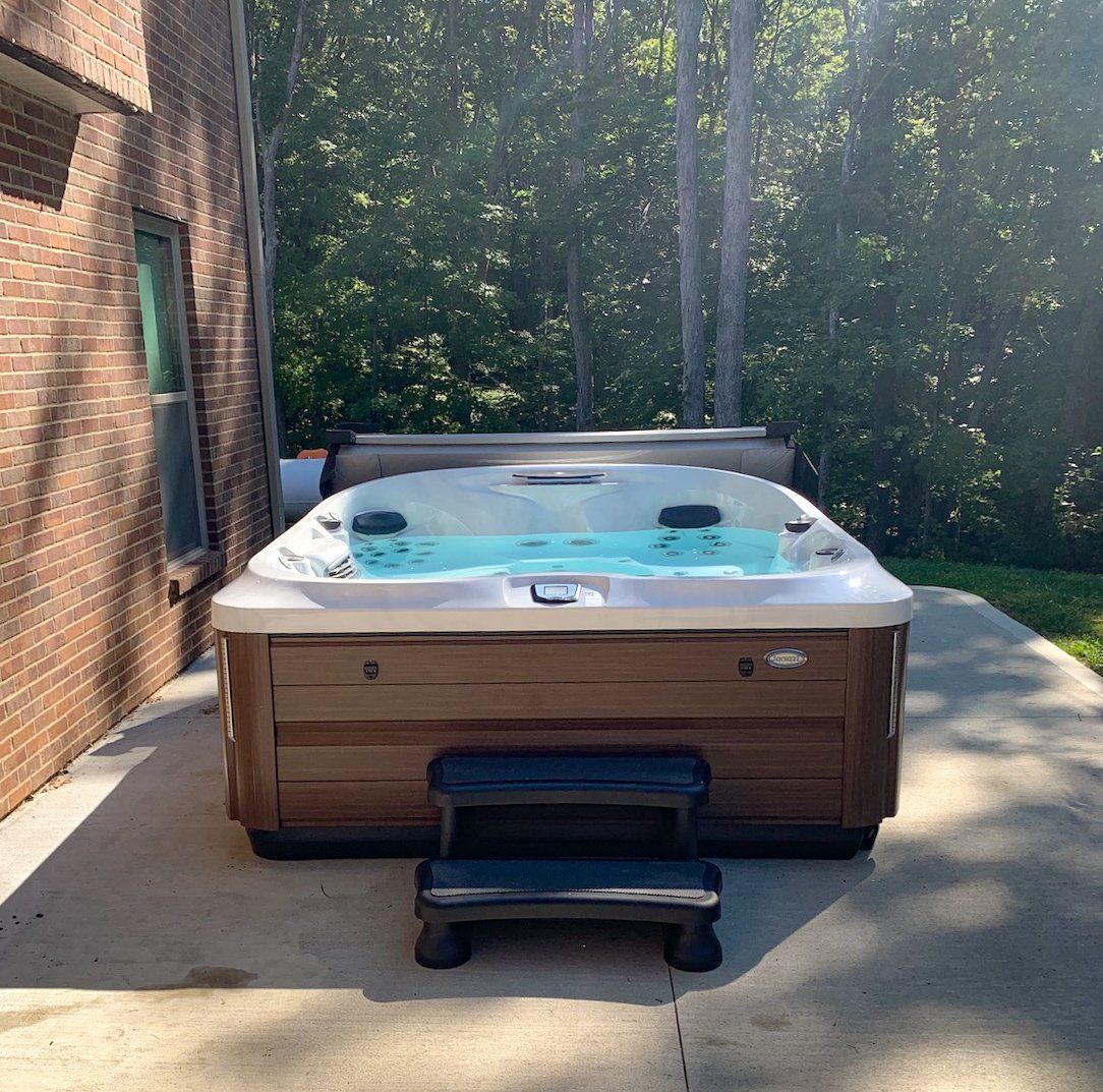A Hot Tub Installed at a Jefferson City, MO Home. Call Columbia Pool & Spa to Shop Hot Tubs for Sale