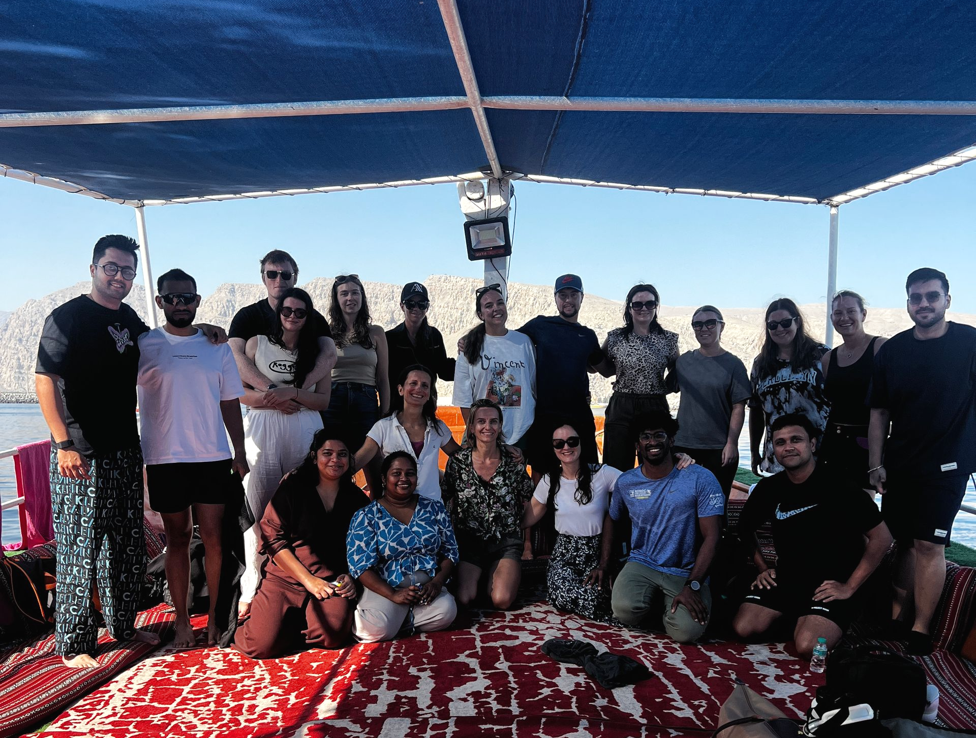 Arabian Wanderers group enjoying their time on a dhow during a 2-day Musandam trip.