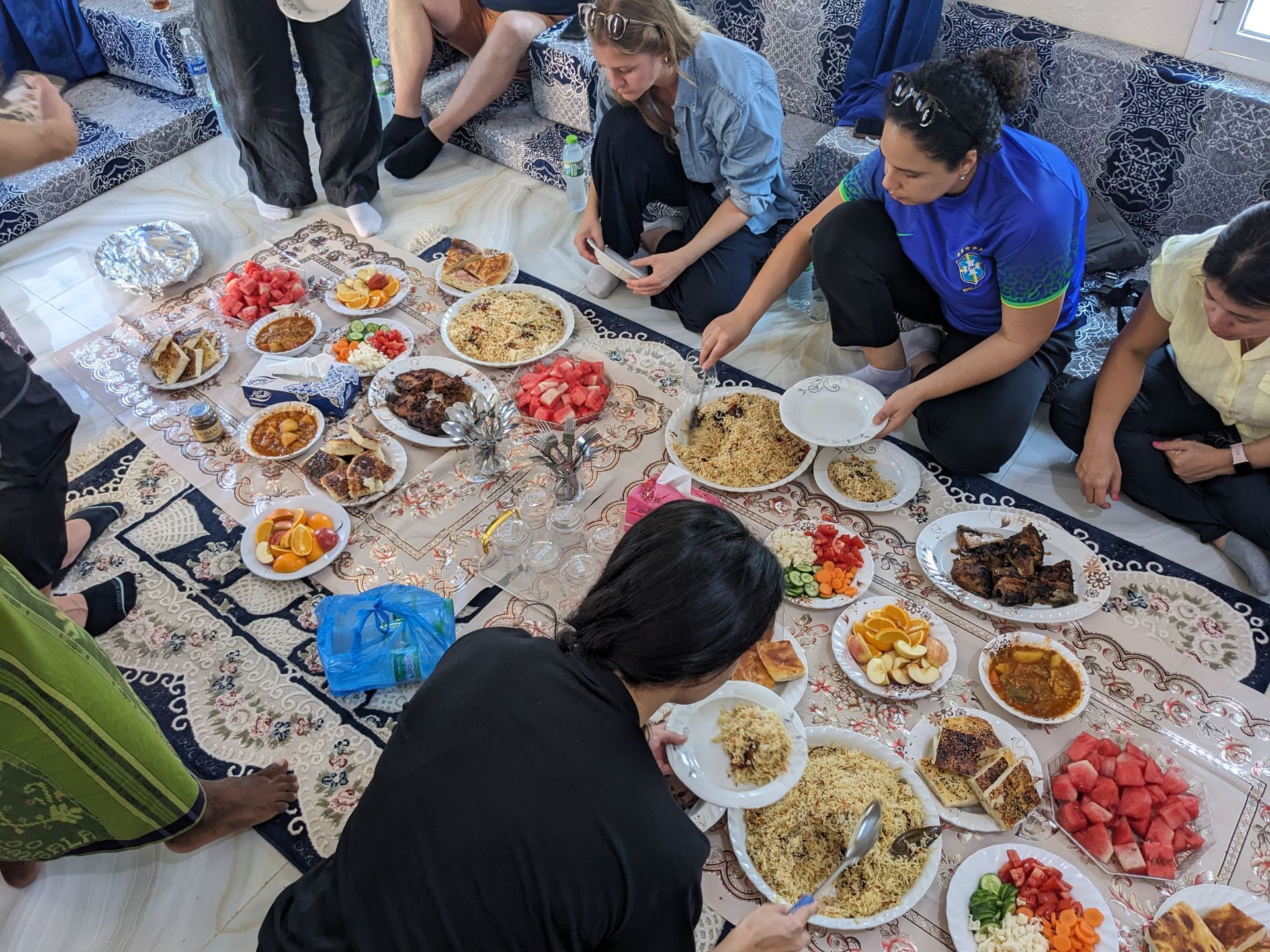 Travelers enjoying a traditional Socotri dinne