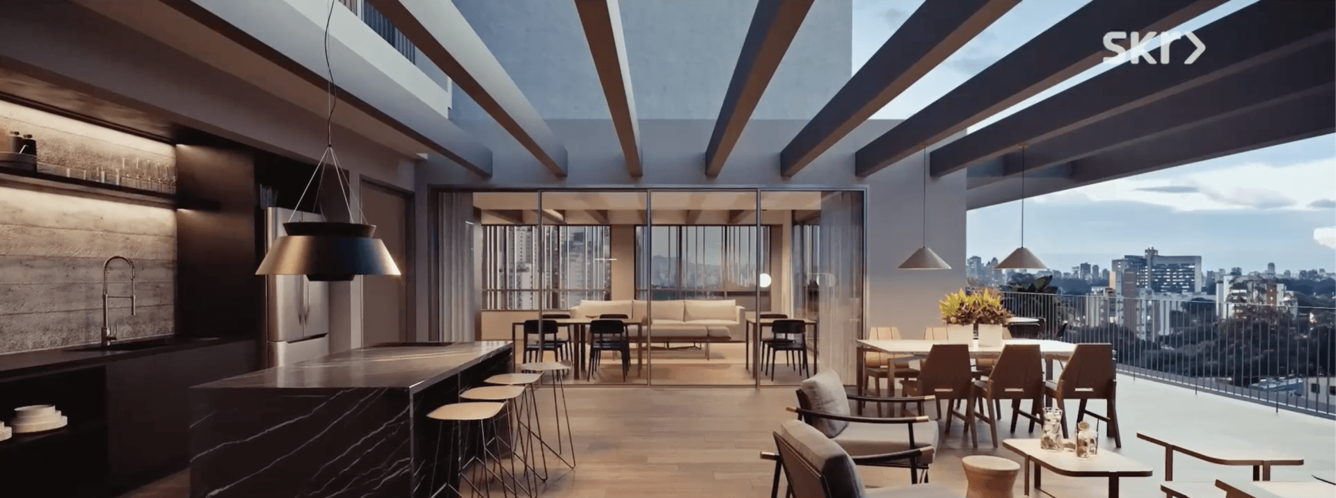 Uma sala ampla com muitos móveis e vista para a cidade.