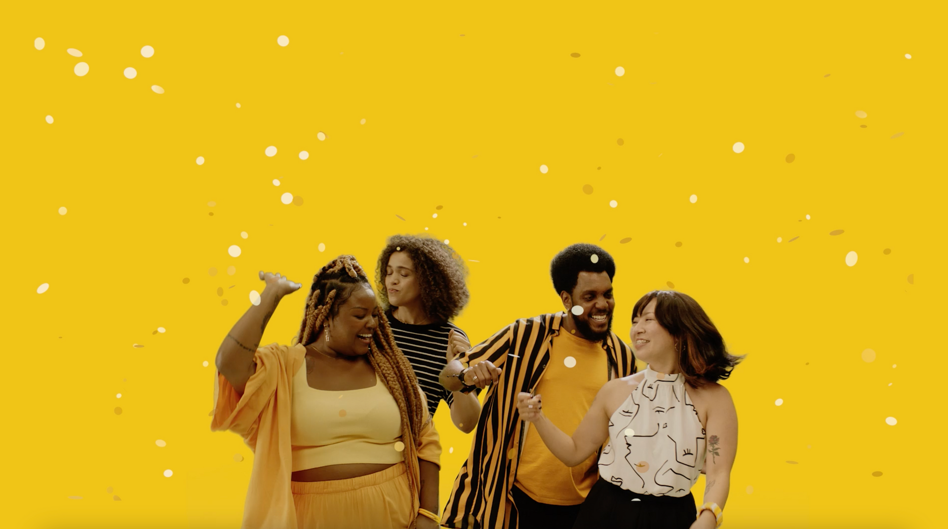 Um grupo de pessoas está dançando juntos em um fundo amarelo.