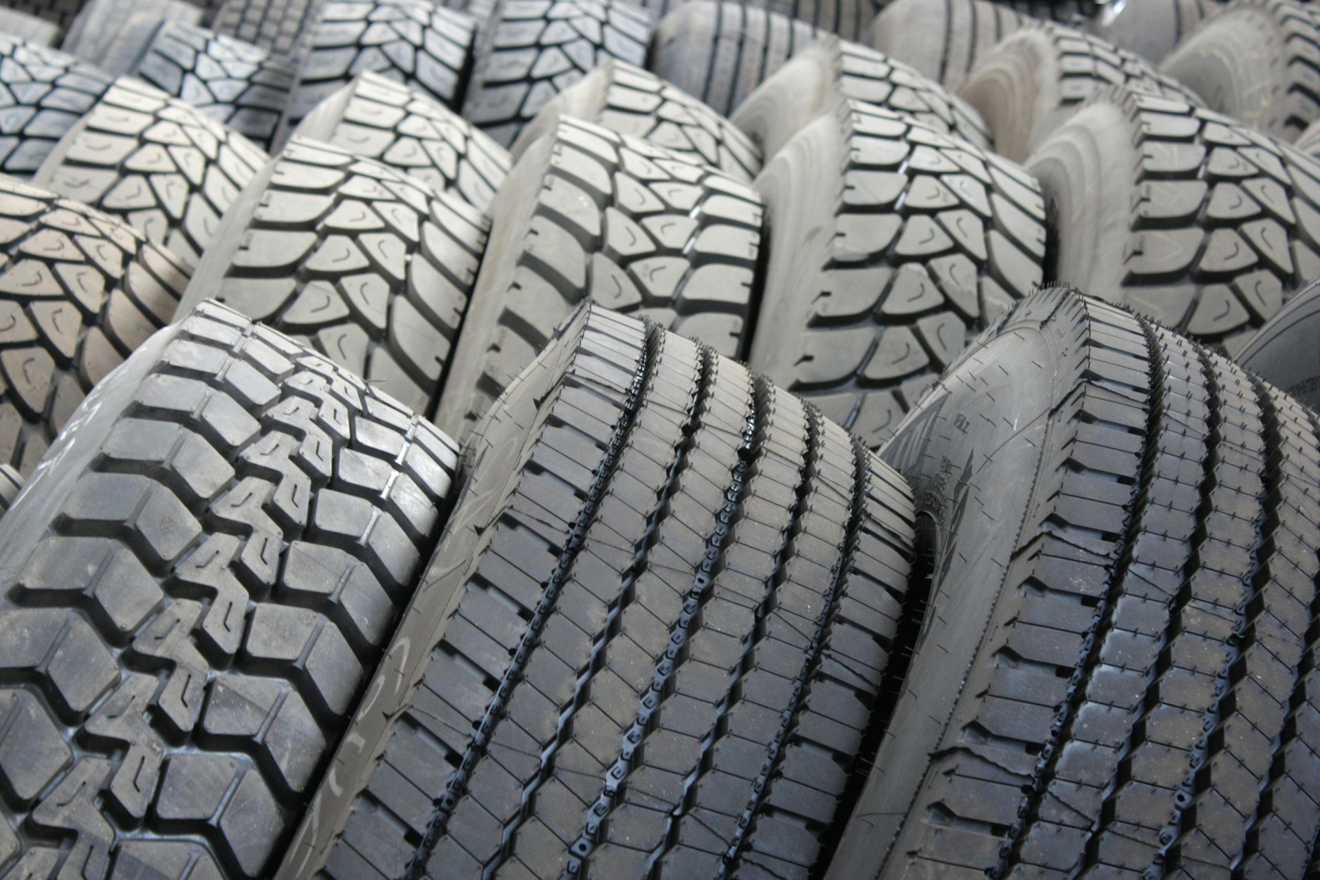 Stacked tires with various tread patterns.