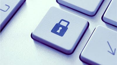 A close up of a computer keyboard with a padlock key