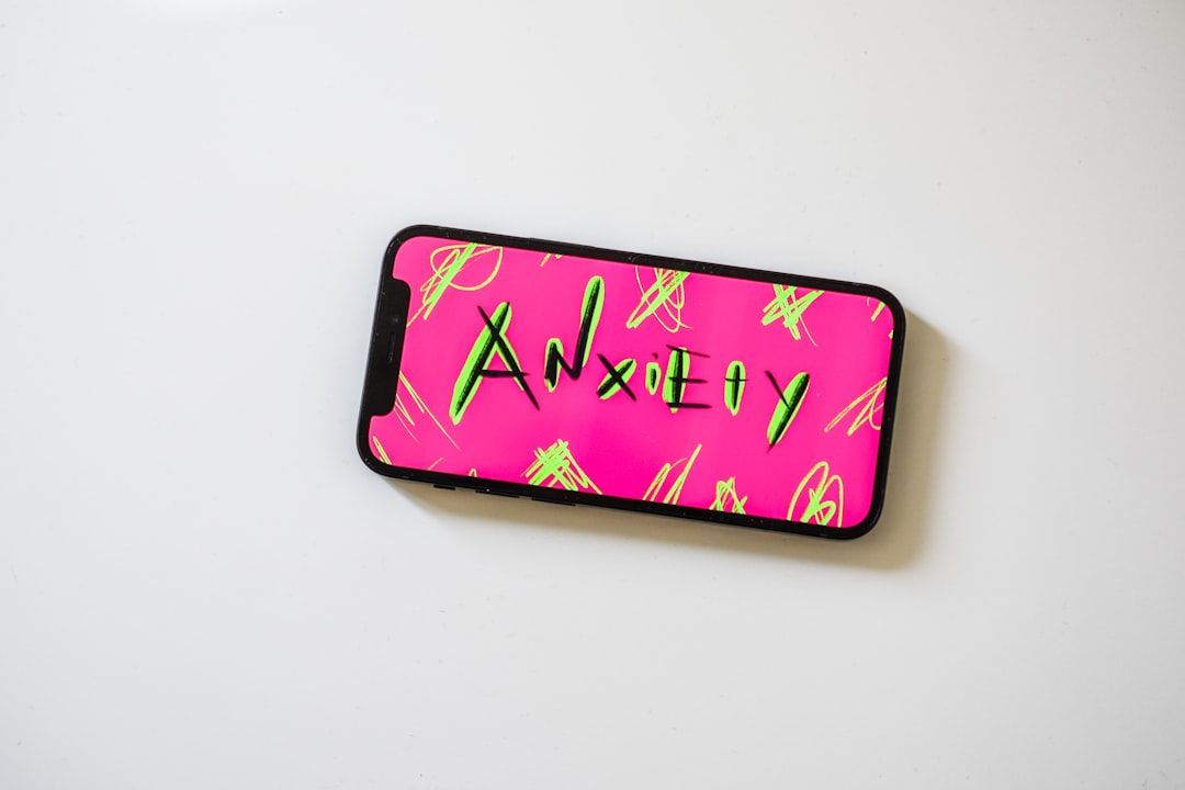 A pink phone displays 