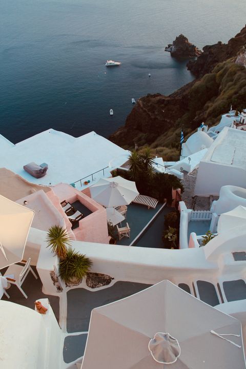 Whitewashed buildings with blue sea view in Santorini, Greece.