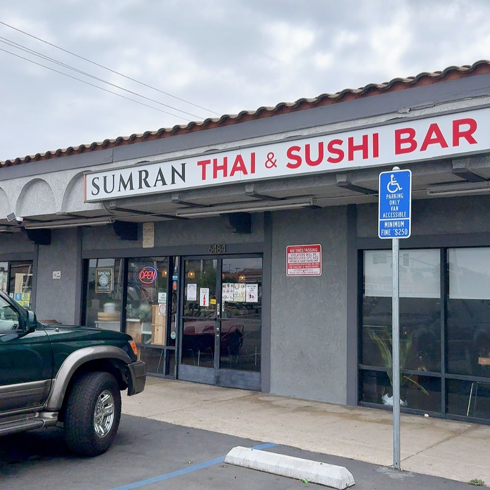 Sumran Thai & Sushi Bar exterior; green vehicle parked in front; handicap parking sign visible.
