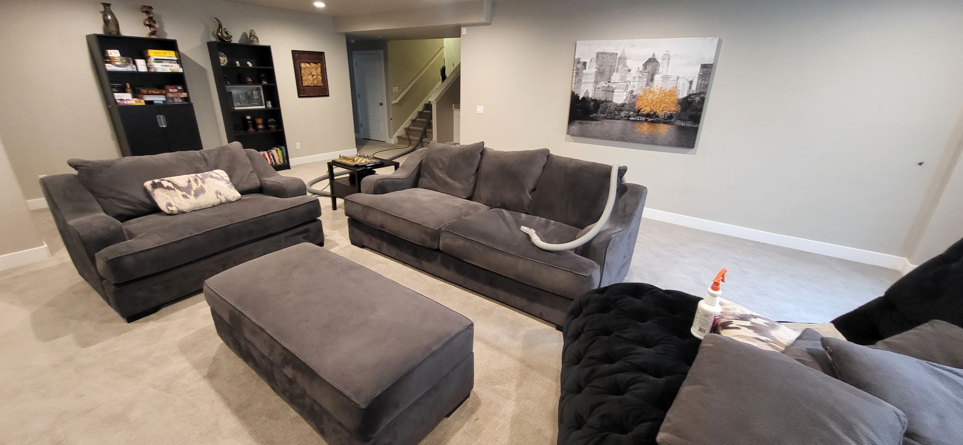 Efficiently using a vacuum cleaner to clean and refresh a couch at home.