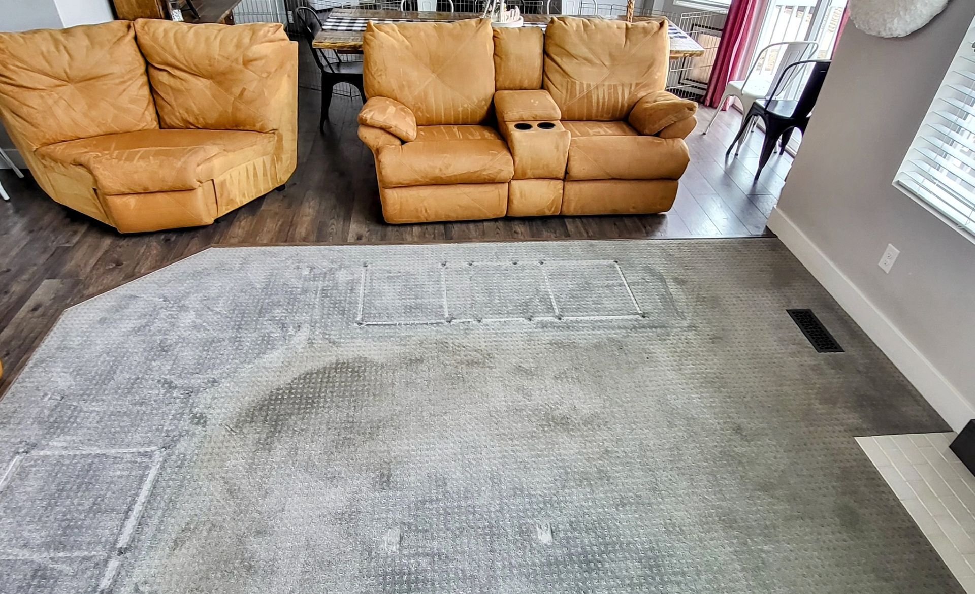 Efficiently cleaning a vibrant blue rug using a modern vacuum cleaner.