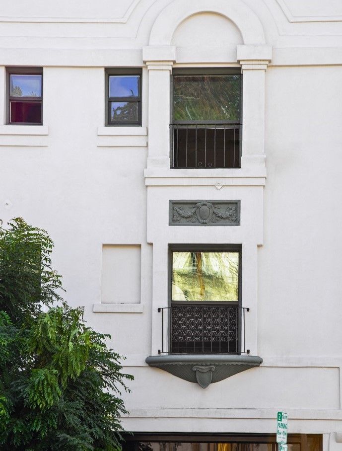 An exterior photo of the Ansley Apartments showing a portion of the facade featuring charming architecture