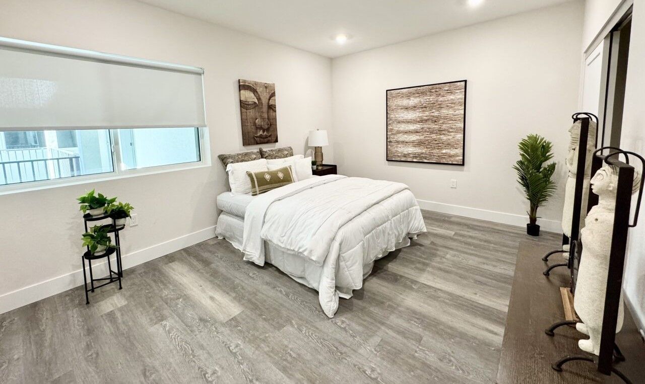 The ultra-spacious interior showing the huge bedroom at The Secret in K-Town Apartments in Los Angeles