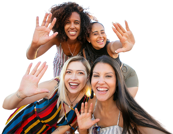 A group of women are waving their hands in the air.