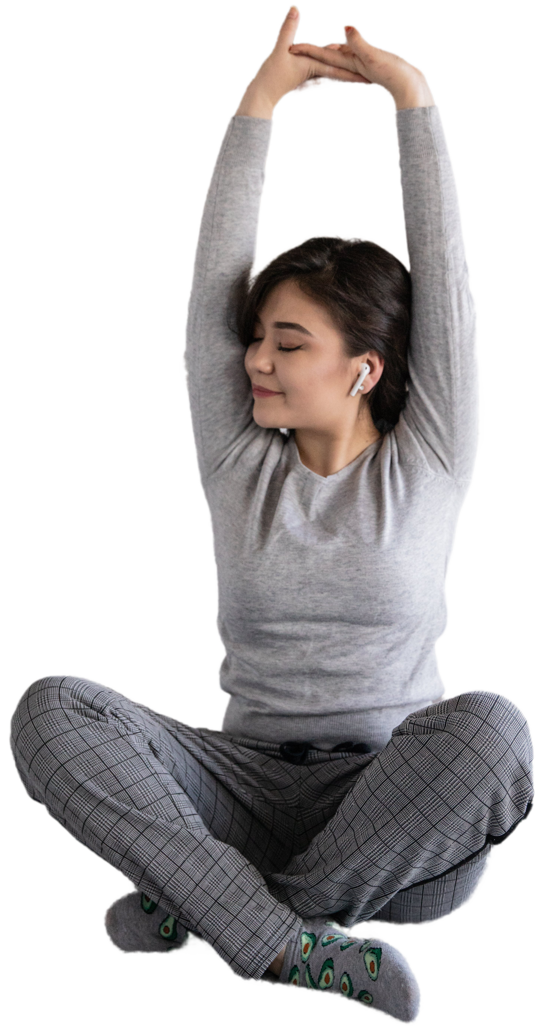 photo of a woman stretching out while exercising in Indian seat position