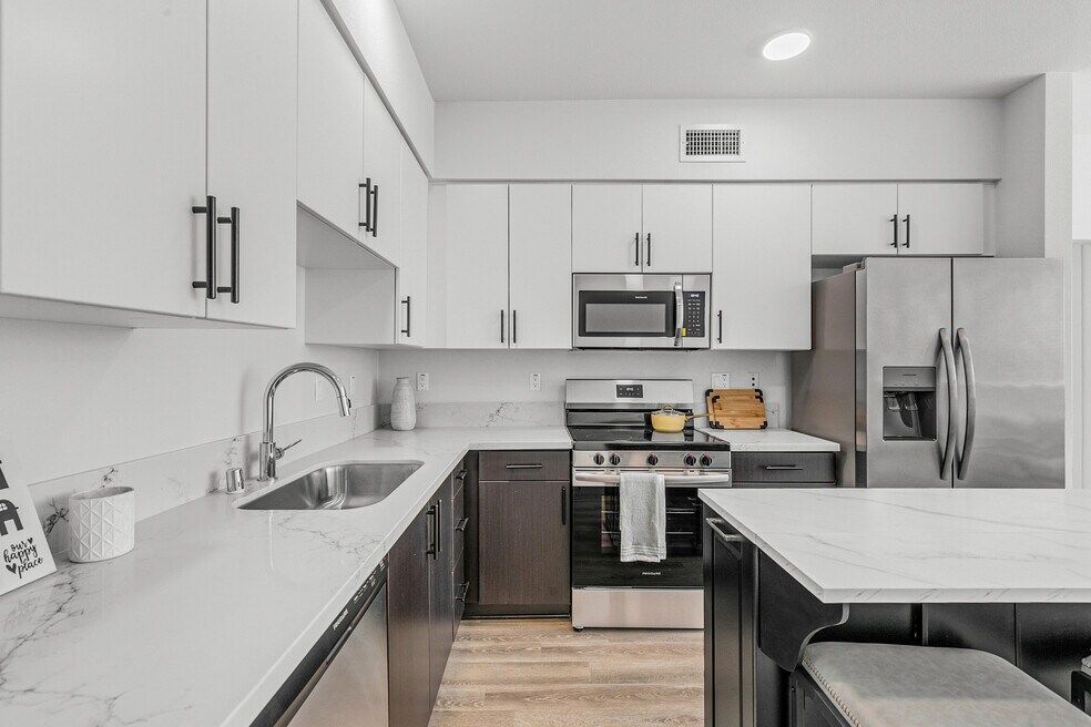 Photo showing the spacious and bright living and dining areas at The MIX Luxury Apartments in West Toluca Lake