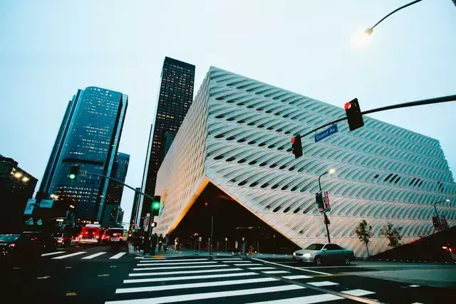 Building facade photo of the Belle building showing modern architecture and several other skyscrapers