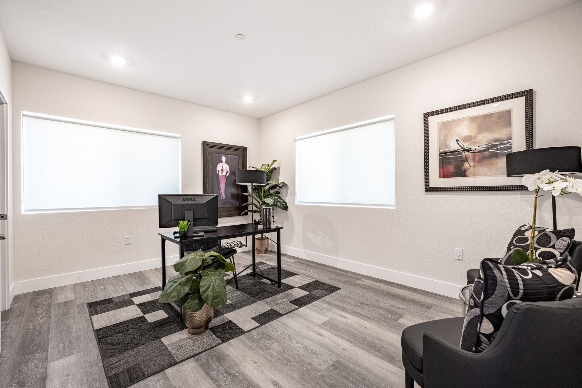 Third bedroom repurposed as a small home office space with lots of natural light in The Secret at K-Town Luxury Apartments