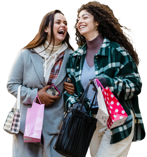 photo showing two women happily shopping