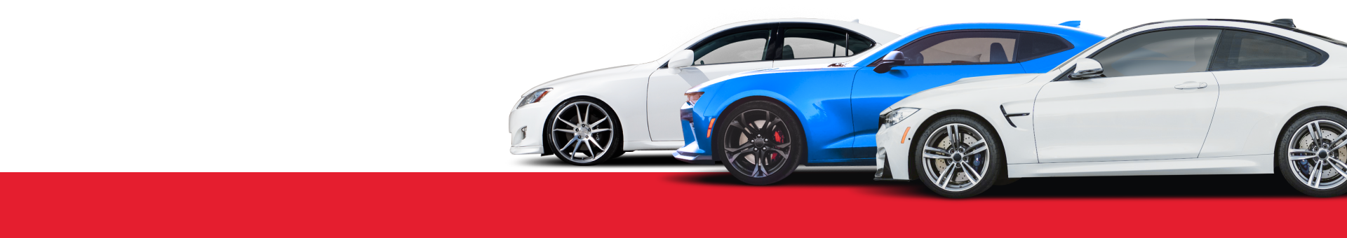 A blue and a white car are parked next to each other on a red carpet. | Oceanside Tire and Service Center Tire Pros