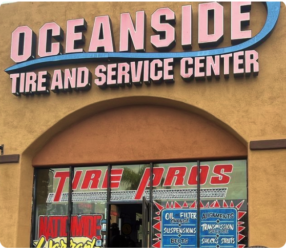 Oceanside tire and service center has a large sign above the door | Oceanside Tire and Service Center Tire Pros
