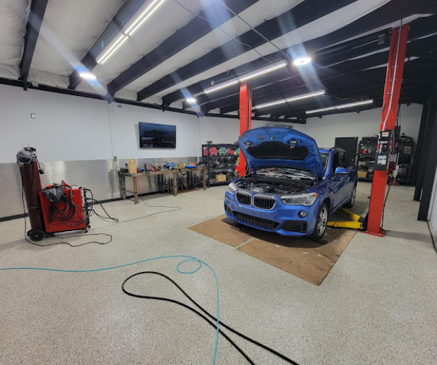 Blue vehicle at our auto repair shop | GERMAN EUROTECH