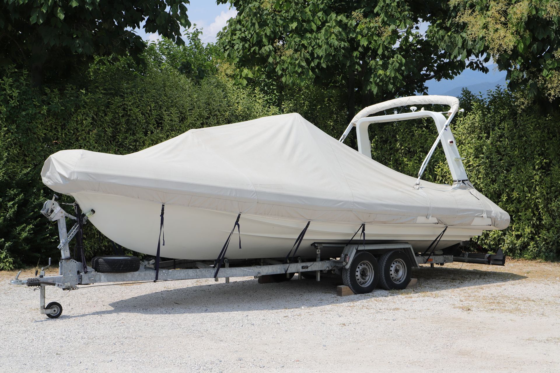 A Row of Orange Trailers Are Parked in A Gravel Lot — Ballarat Trailer Hire in Alfredton, VIC