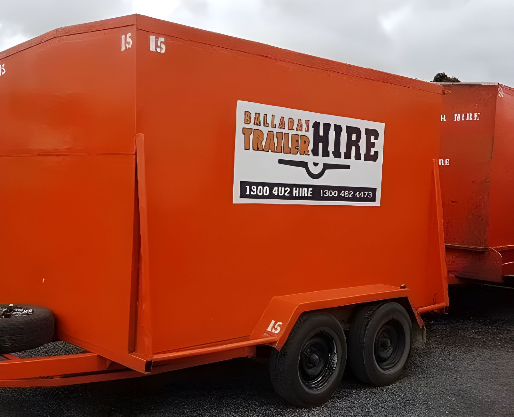 An Orange Furniture Van Trailer Sitting On Road — Ballarat Trailer Hire in Alfredton, VIC