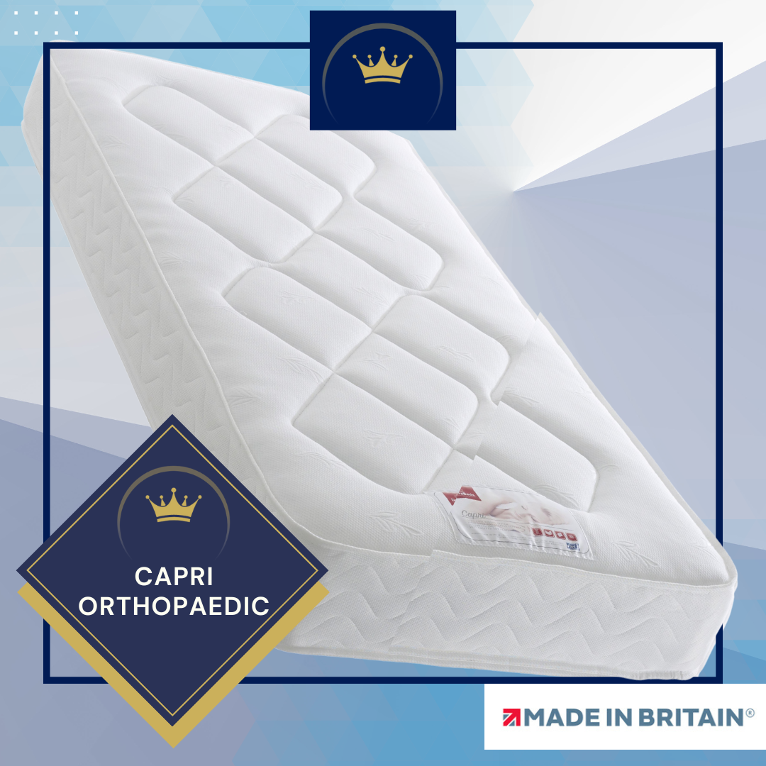 A white mattress made in britain with a crown on it