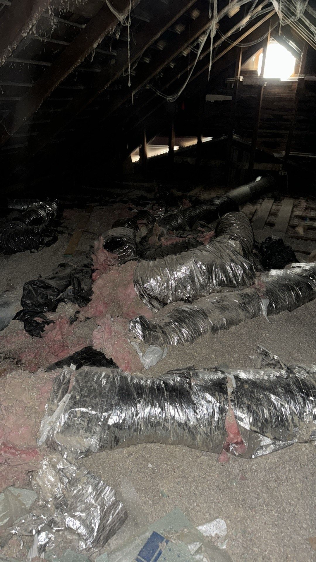 There is a lot of insulation in the attic of a house.