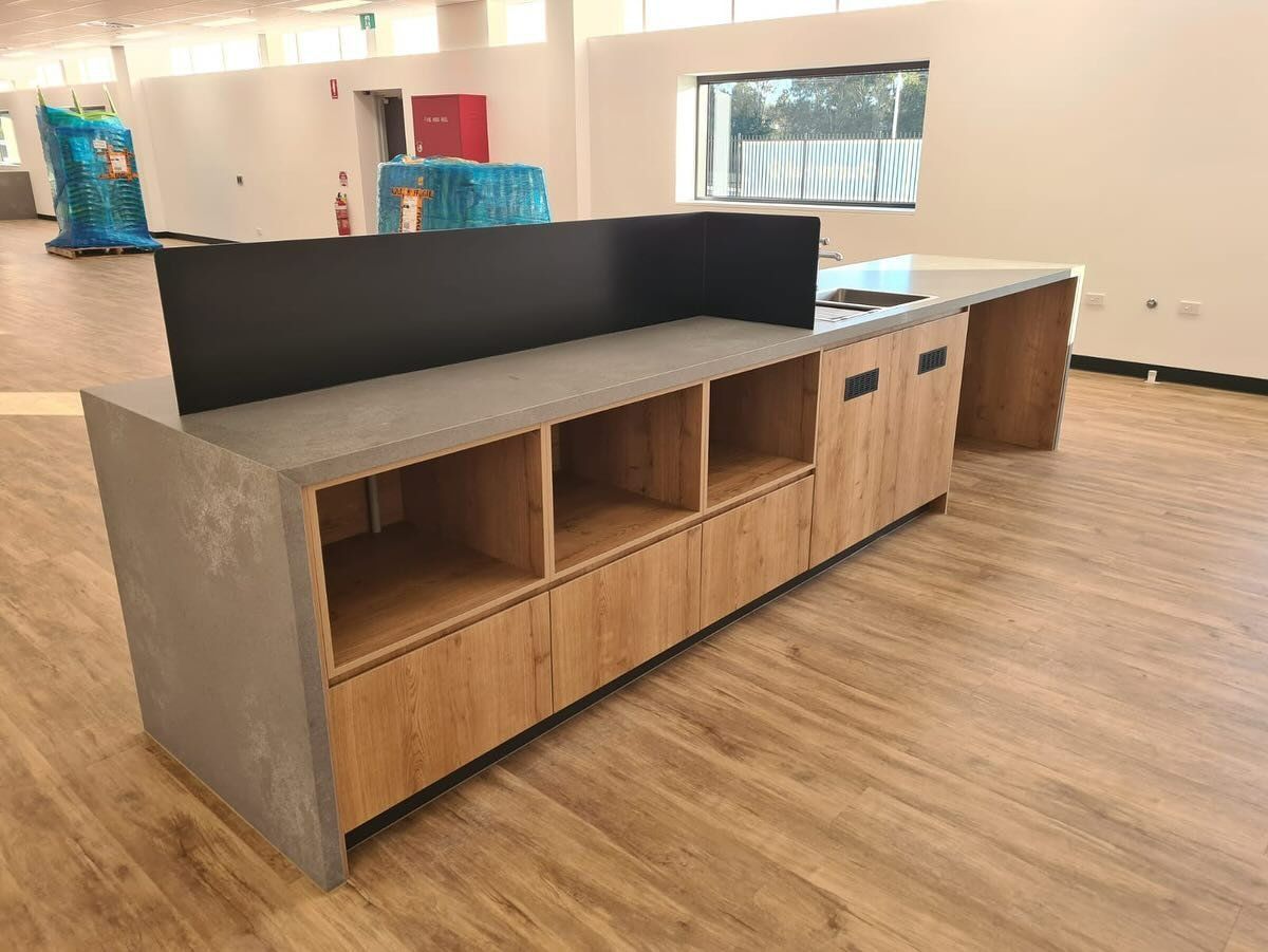 A Modern Reception Desk With A Gray Countertop — Zeal Interiors in South Grafton, NSW