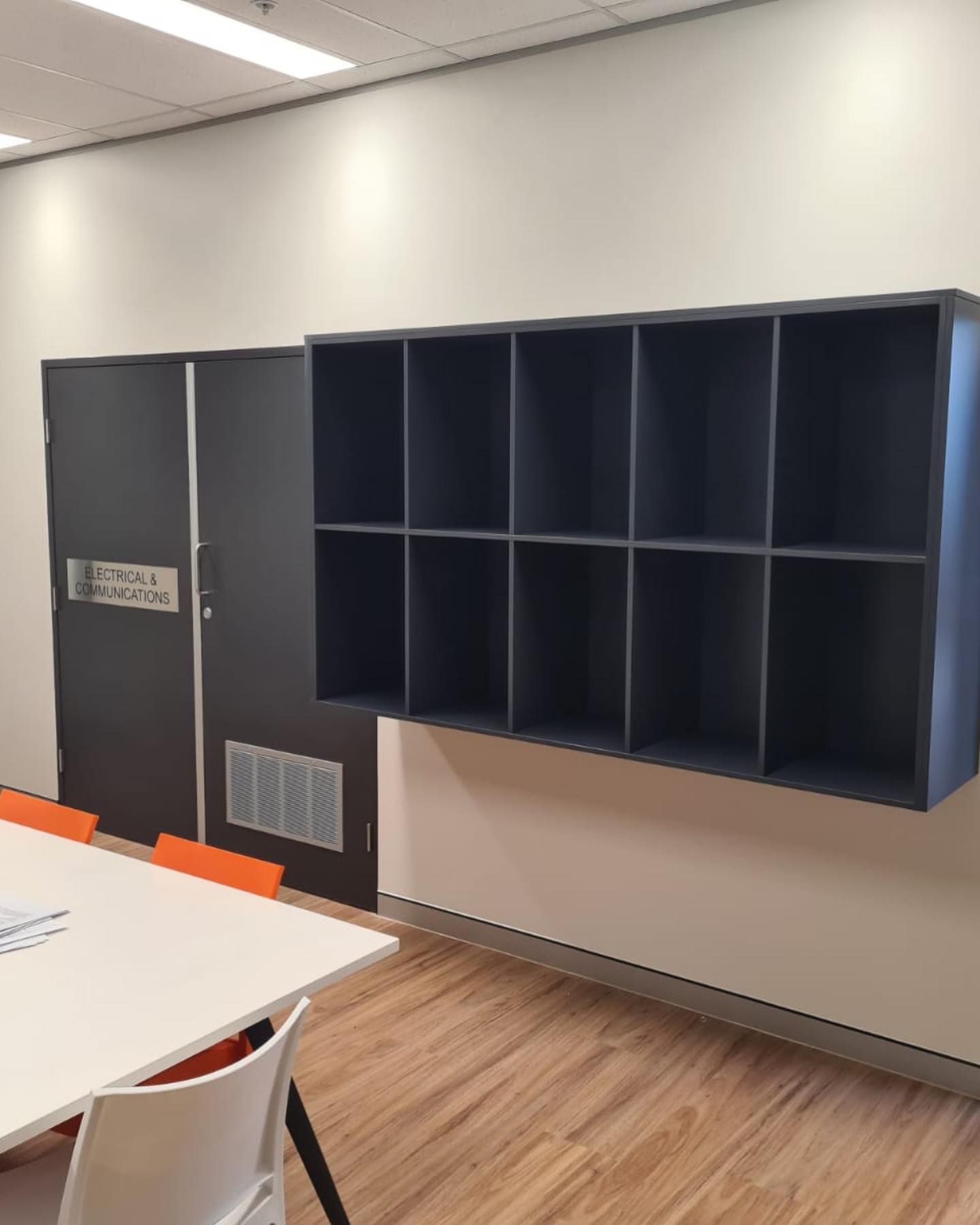 Storage Unit With Cubby Holes And A Grey Door — Zeal Interiors in South Grafton, NSW