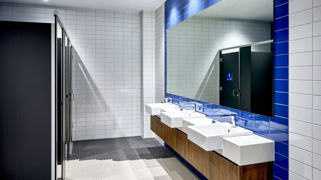 Public Restroom With White And Blue Tiled Walls — Zeal Interiors in South Grafton, NSW