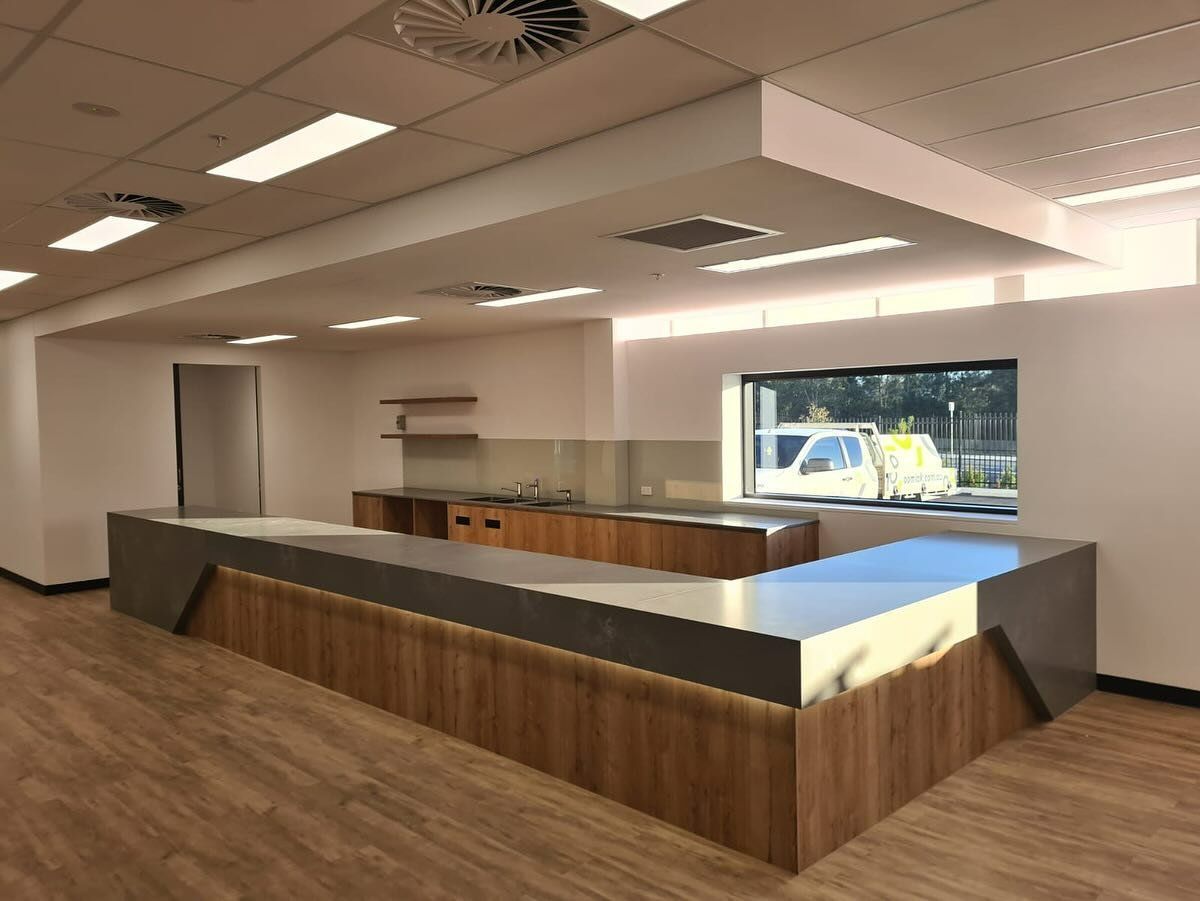 A Modern, U-shaped Kitchen With Wooden Cabinets — Zeal Interiors in South Grafton, NSW