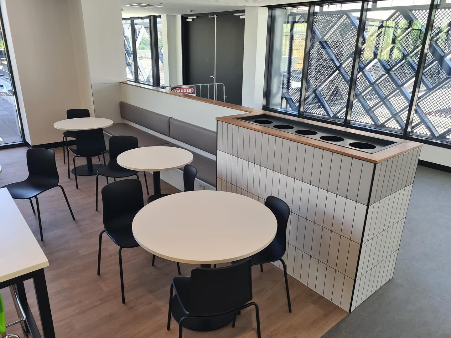 Cafeteria Seating Area with Round White Tables — Zeal Interiors in Newcastle, NSW