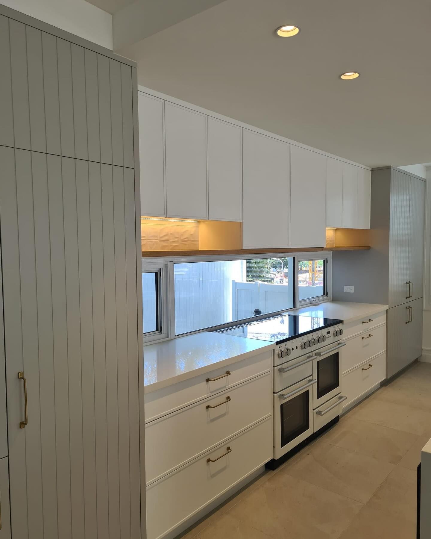 Modern White Kitchen with Upper Cabinets — Zeal Interiors in Coffs Harbour, NSW