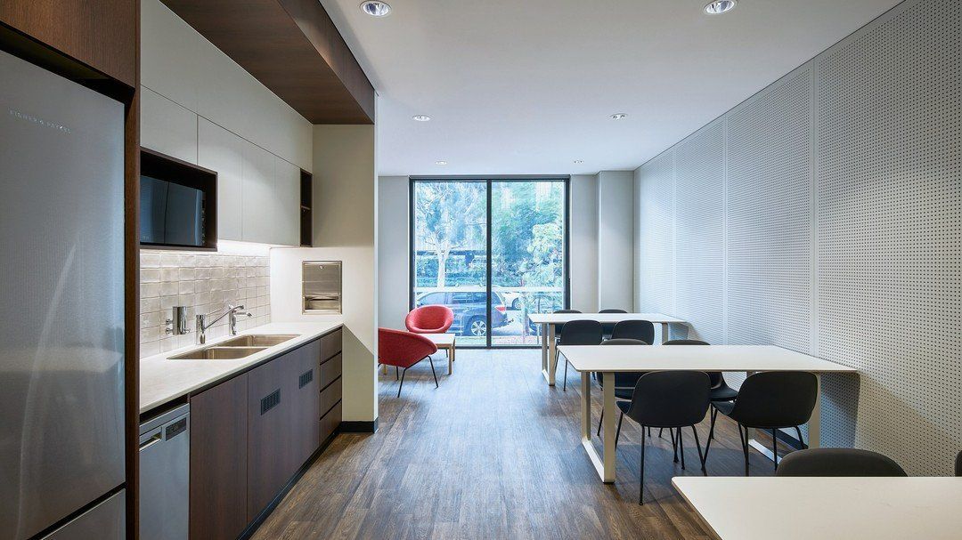 Modern Kitchen And Workspace With Tables And Chairs — Zeal Interiors in South Grafton, NSW