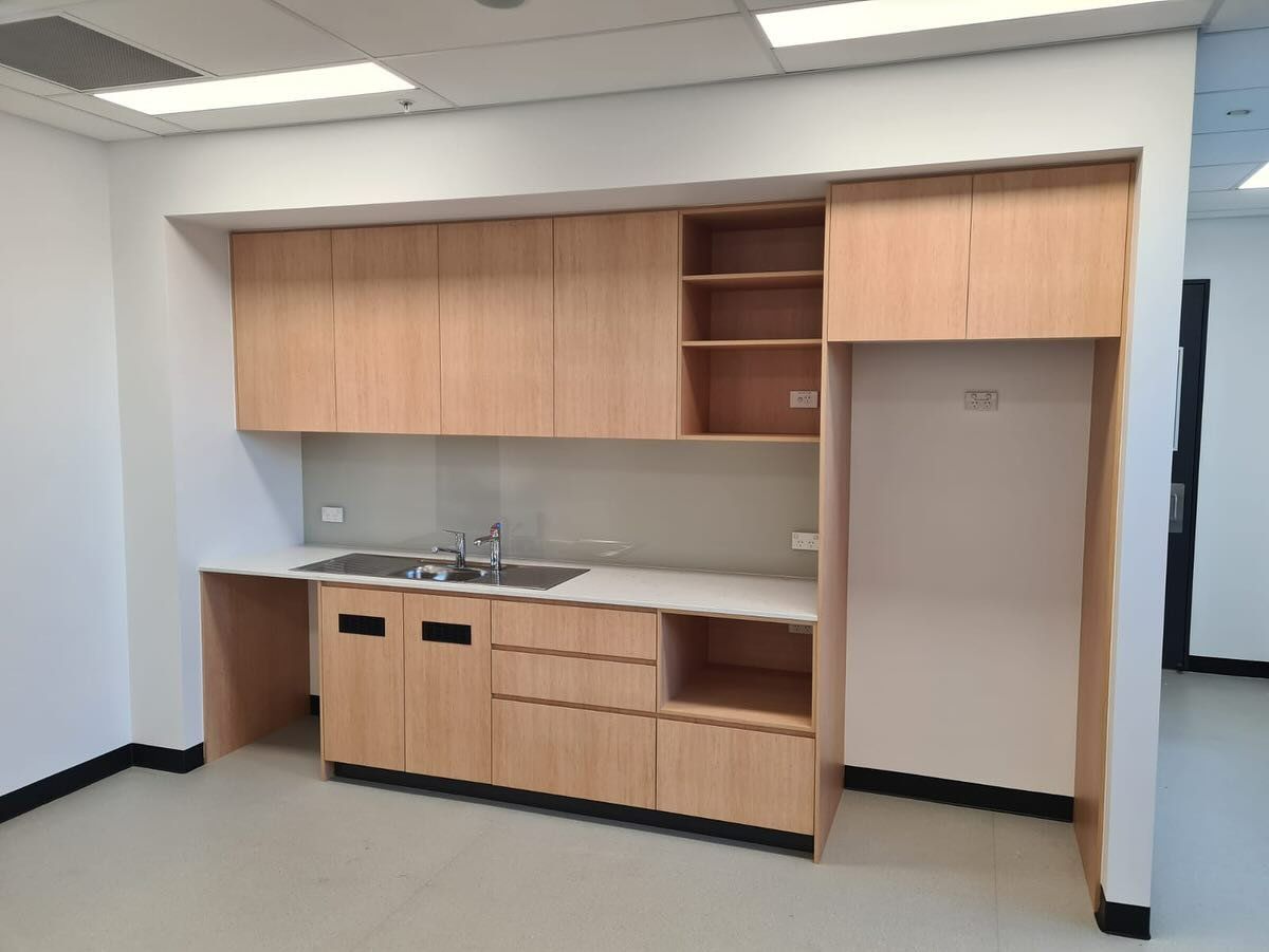 Public Restroom With Multiple White Sinks And A Large Mirror — Zeal Interiors in South Grafton, NSW