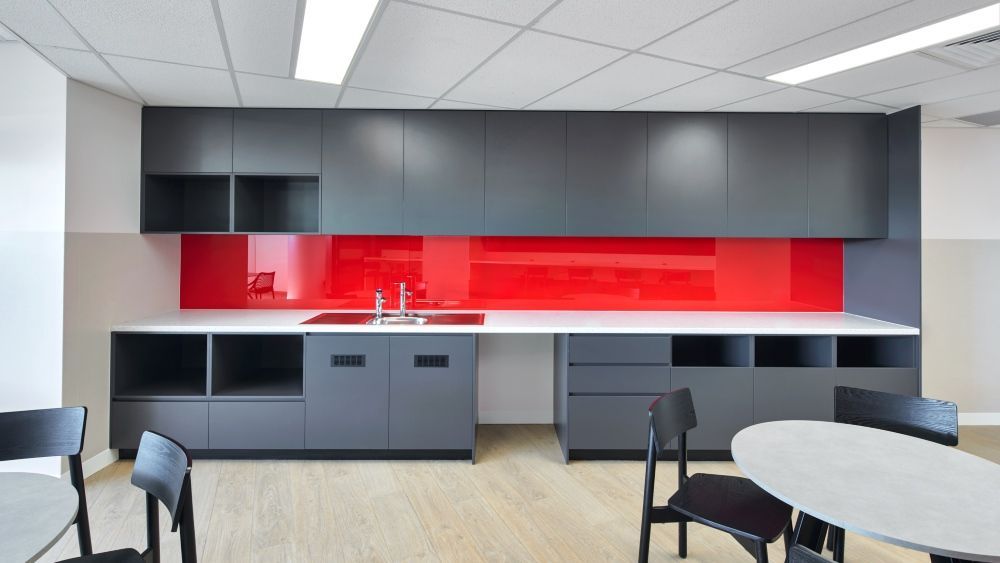 Office Break Room With Red Backsplash, Gray Cabinets — Zeal Interiors in South Grafton, NSW
