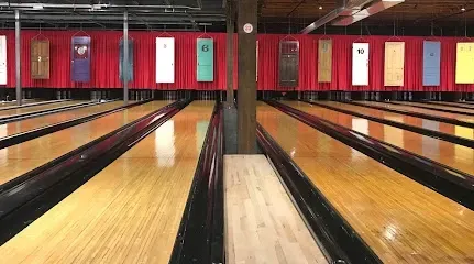 Chimney sweep portland maine - Bowling alley with multiple lanes extending into the distance, featuring a red curtain backdrop with numbered signs.