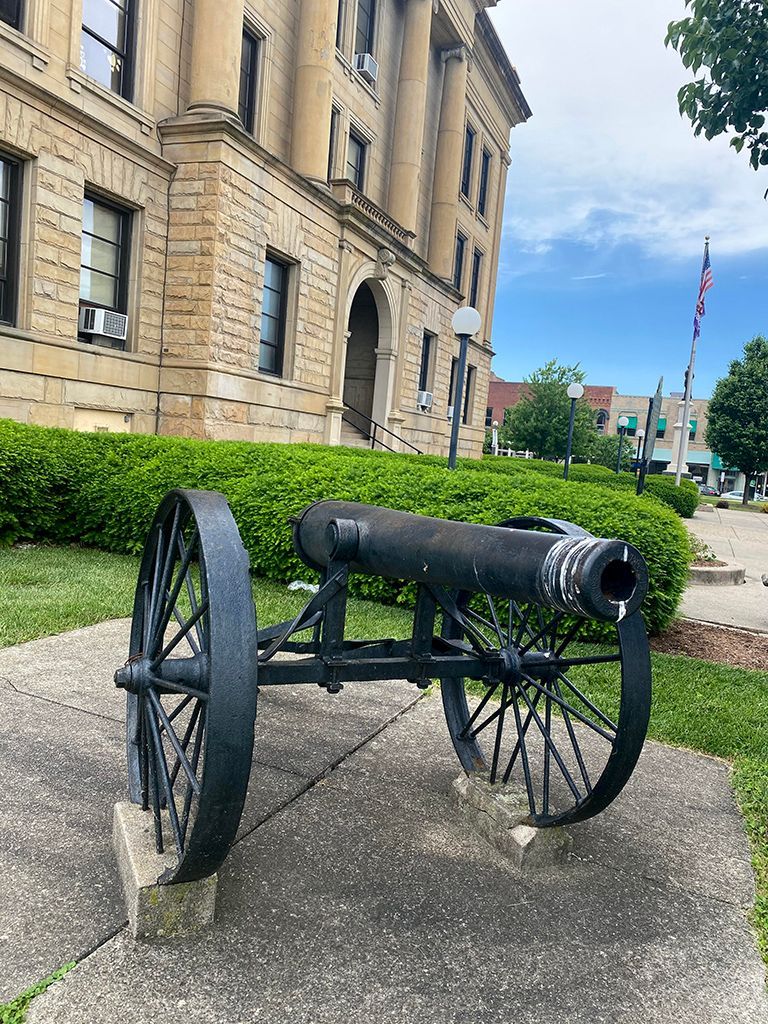 A historical marker for lorain county is in front of a building