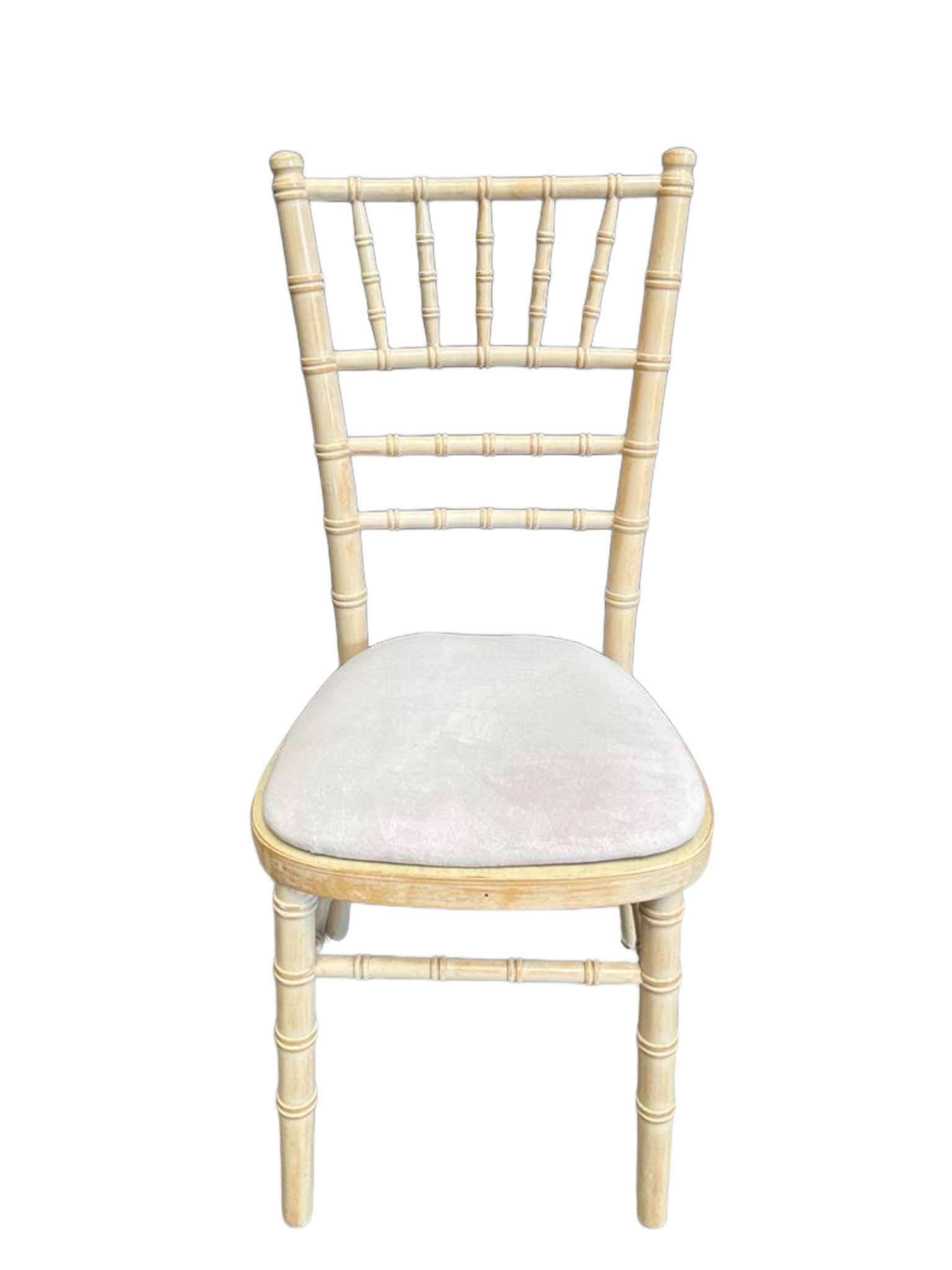Limewash Chivari chair with padded seat. wedding chau