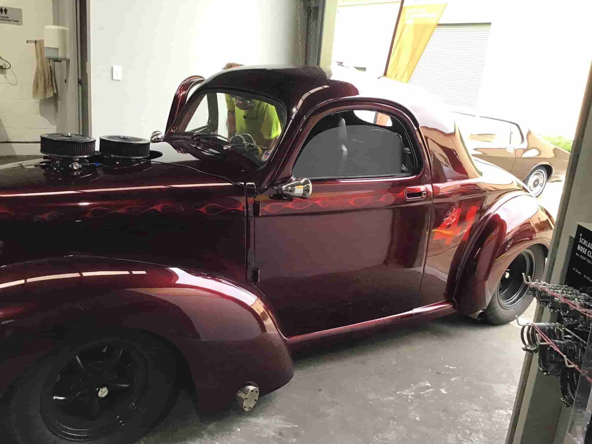 A Red Car is Parked in a Garage — AA Automotive Repairs in Forster, NSW