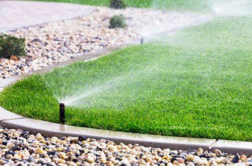 What Determines the Optimal Sprinkler Layout on a Lawn?