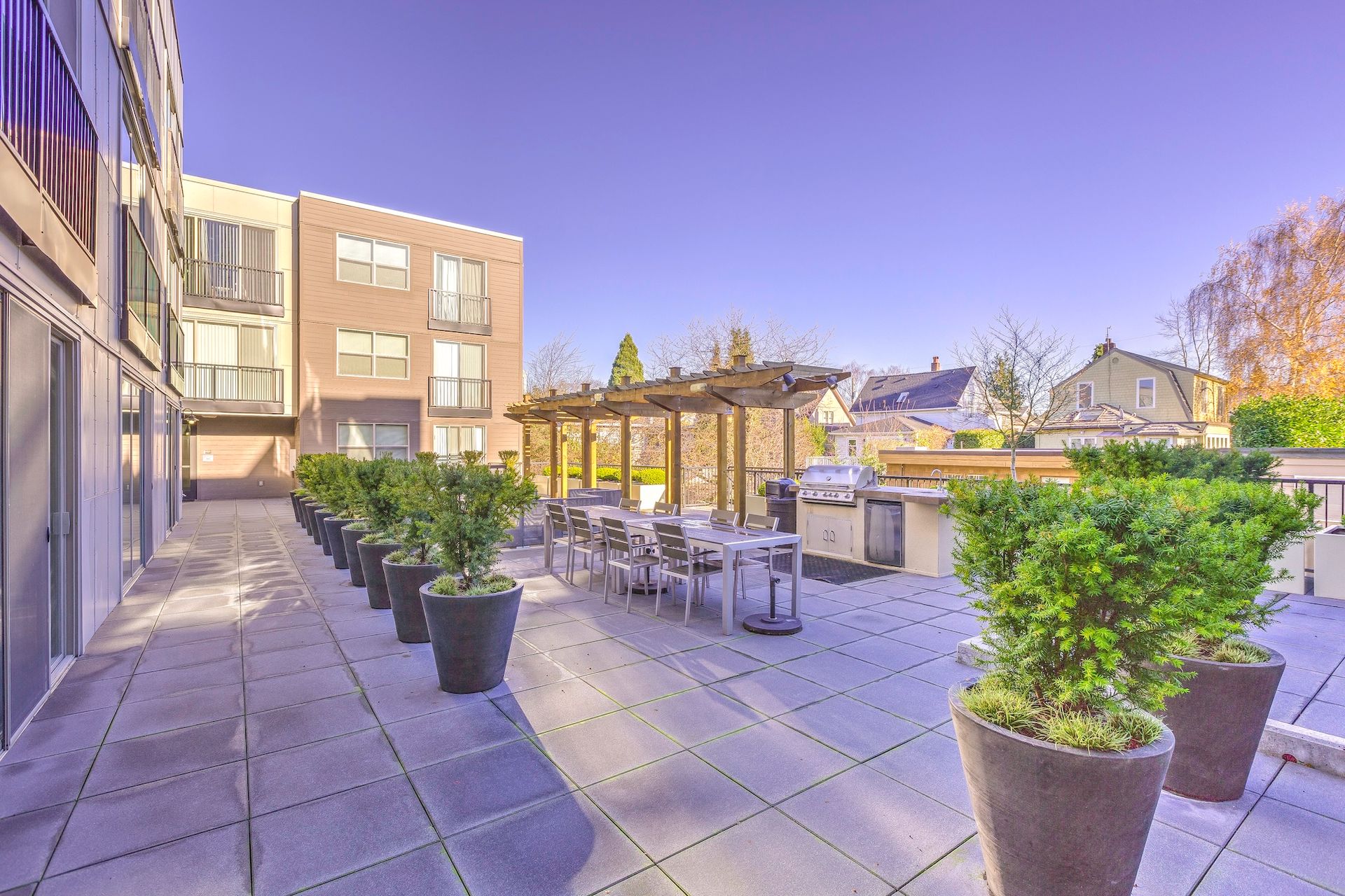 deck with potted plants and bbq area