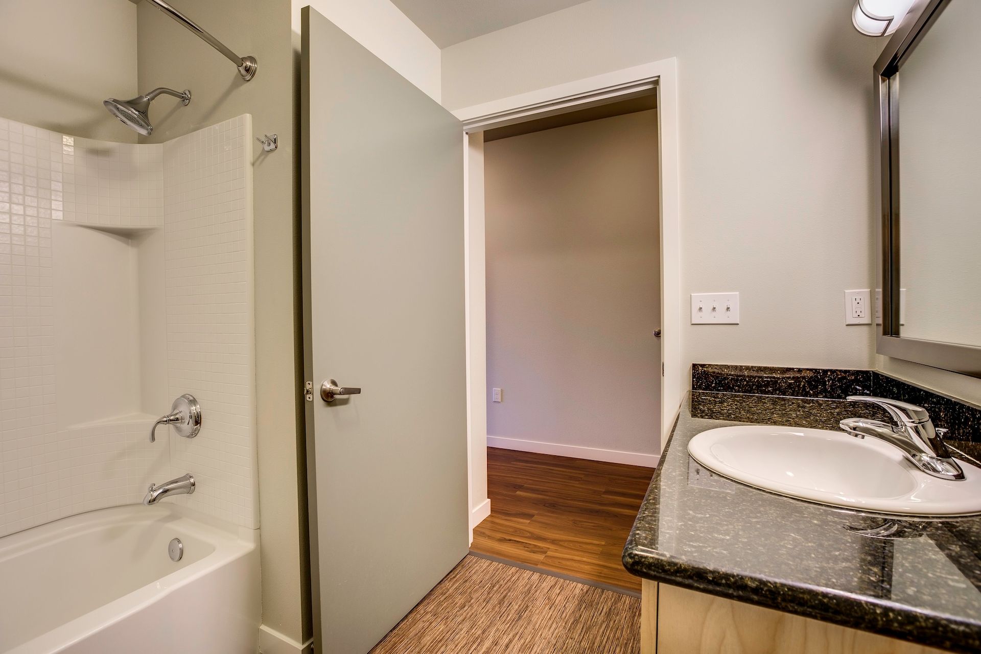 bathroom with black countertops