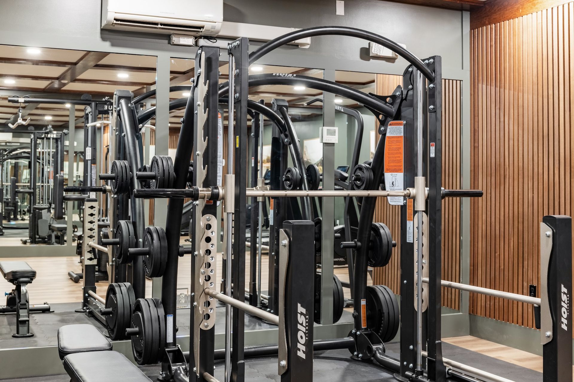 squat rack at gym with mirror 