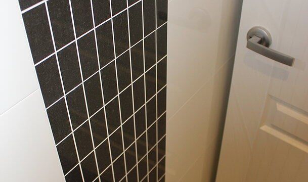 Bathroom Wall Tiles & Door — Builders  in Fernhill, NSW